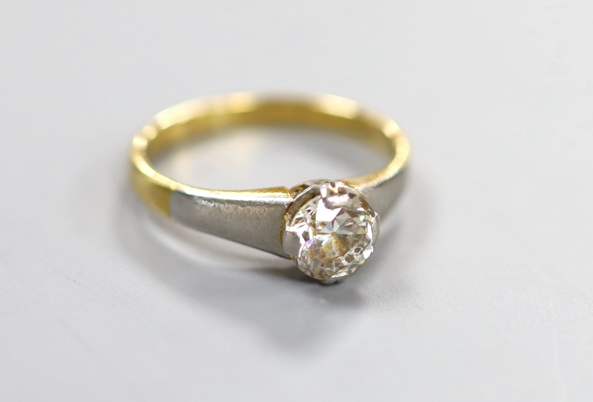 A yellow metal and solitaire diamond ring, the stone weighing approx. 0.75-0.80ct, size K, gross weight 3.5 grams.